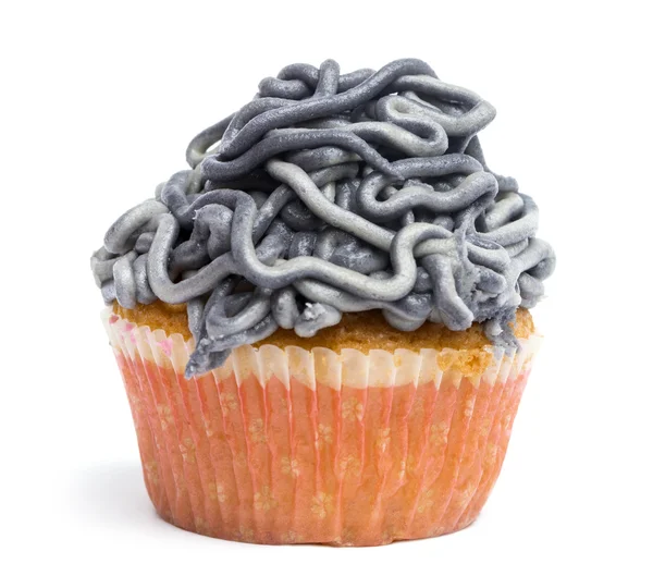 Cupcake with gray icing against white background in front of white background — Stock Photo, Image