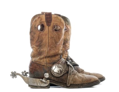 Side view of a pair of Cowboy boots with spurs, isolated on whit clipart