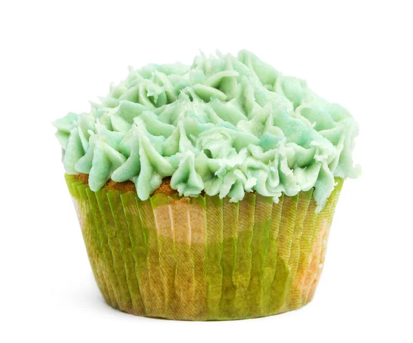 Cupcake with green icing against white background in front of white background — Stock Photo, Image