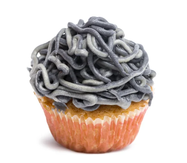 Cupcake with gray icing against white background in front of white background — Stock Photo, Image
