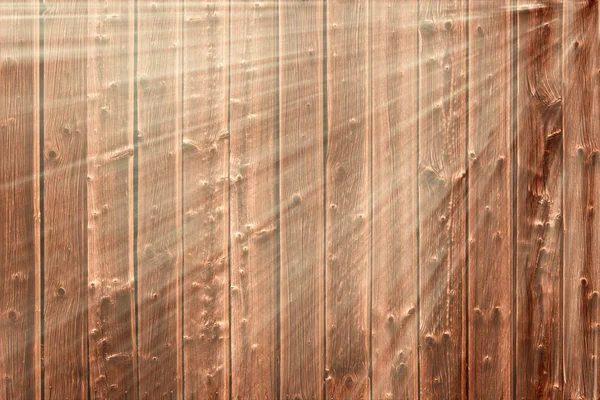 Dark wooden gnarly background in sunbeams — Stock Photo, Image