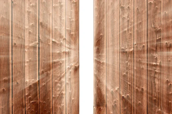 Gat in de houten hek en de opkomende licht — Stockfoto