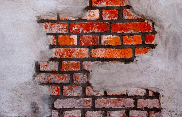 Stucwerk op een bakstenen muur — Stockfoto