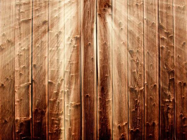 Wooden background in sunbeams — Stock Photo, Image