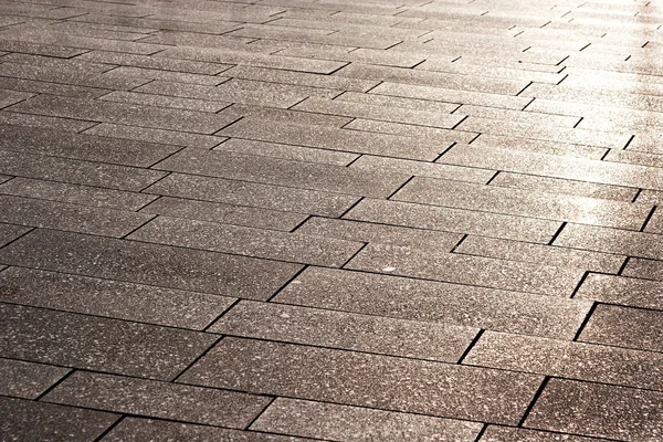 A street pavement and reflected sunlight — Stock Photo, Image