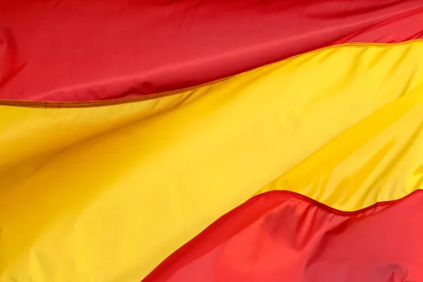 바람에 나부끼는 스페인 국기 스톡 이미지