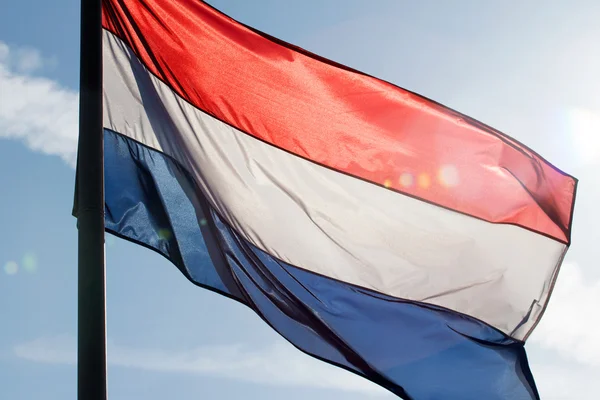 Nederlandse vlag in een zonnestraal — Stockfoto