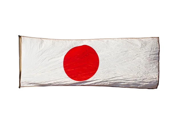 Isolierte japanische Flagge im Wind auf weißem Hintergrund — Stockfoto