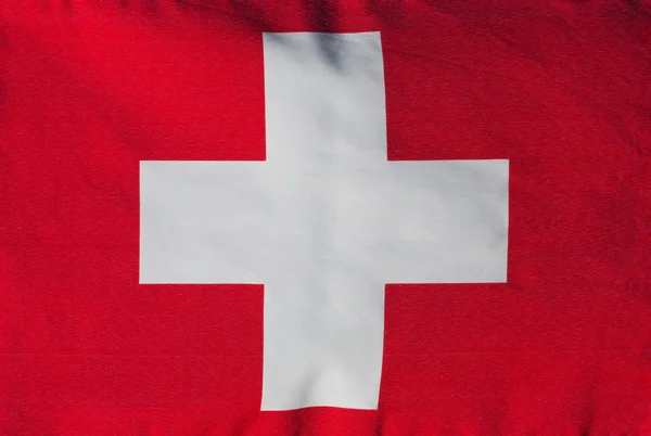 Swiss vlag in de wind close-up — Stockfoto