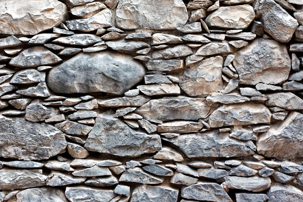 Muur gemaakt van ruwe steen — Stockfoto