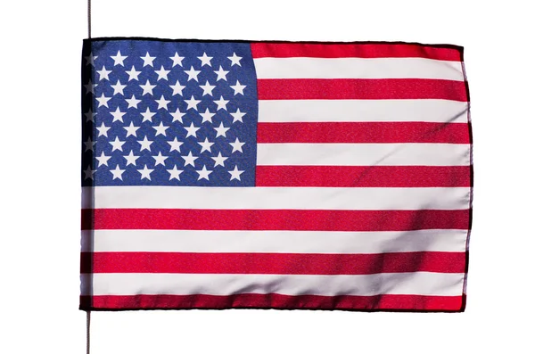 Amerikanska flaggan i vinden på en vit bakgrund — Stockfoto