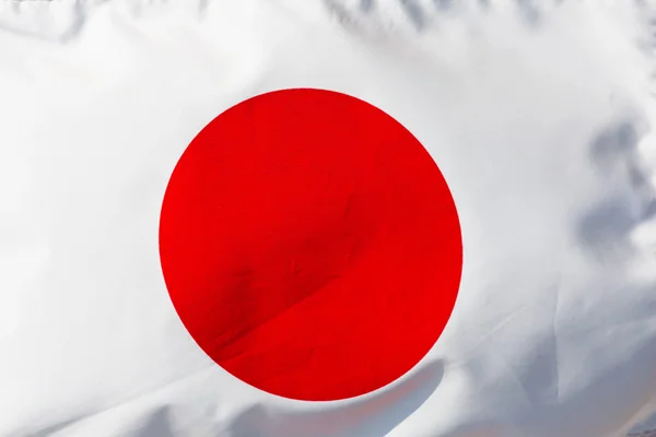 Fragment of the Japanese flag in the sunlight — Stock Photo, Image