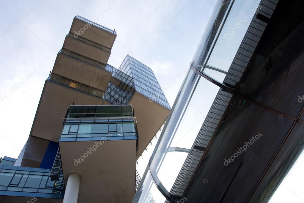 Modern glass architecture of office building against sky