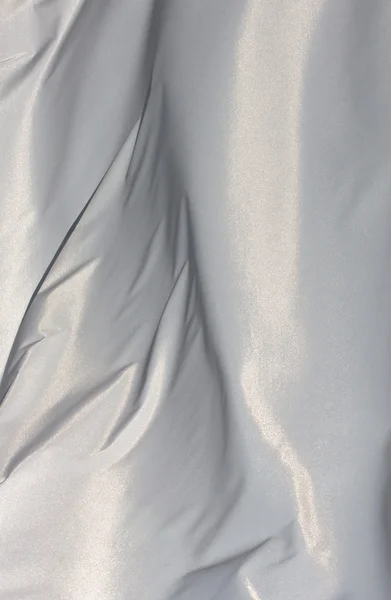 Белая ткань на ветру при солнечном свете — стоковое фото
