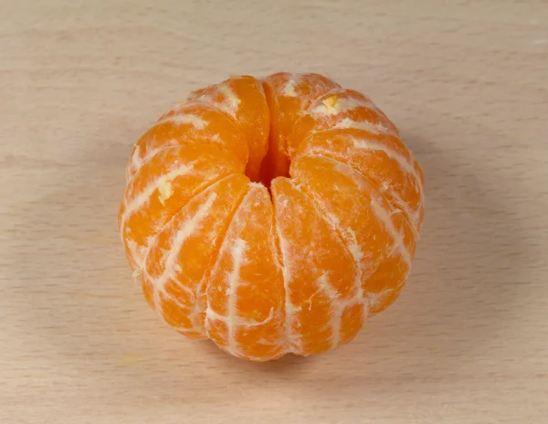 Tangerine on the wooden surface — Stock Photo, Image