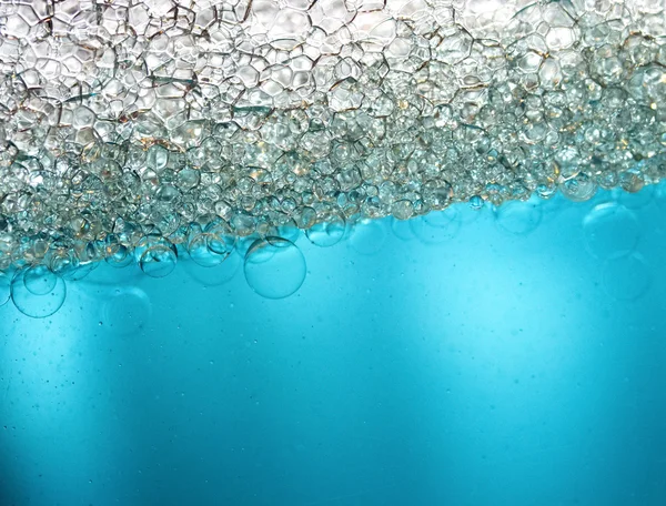 Air bubbles in a aquamarine water — Stock Photo, Image