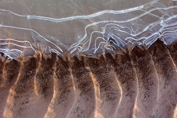 Frozen and icy river bottom in sunshine — Stock Photo, Image