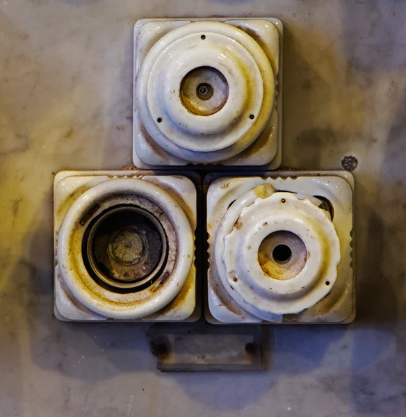 The old ceramic fuses on a wall — Stock Photo, Image