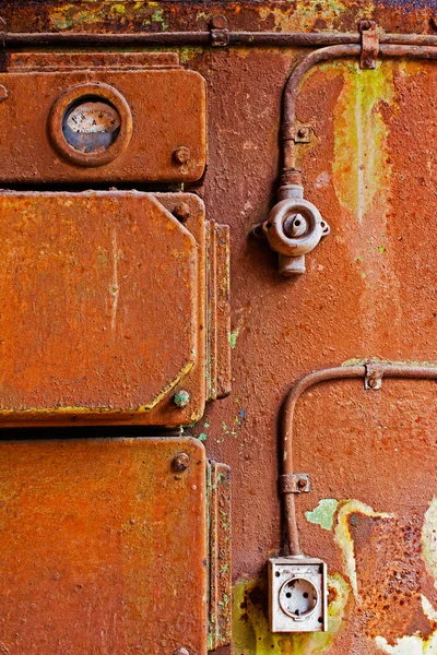 Switch socket and meter on old iron wall — Stock Photo, Image