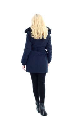full length portrait of blonde woman wearing long winter coat. and casual clothes. standing pose, isolated on a white studio background. clipart