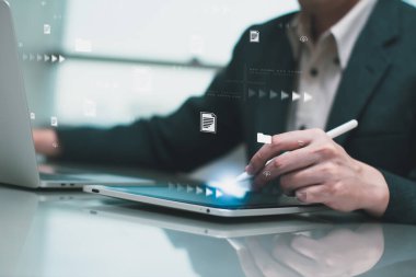 Businessman working on laptop computer,online electronic document information database,digital file cloud storage system or software, online compliance rules user management,business platform control