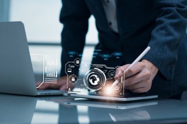 Businessman using tablet computer,analysis business and economic data growth network diagram communication technology,financial banking,digital marketing strategy,business finance corporate concept