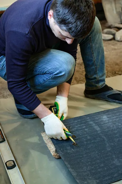Master Prepares Bitumen Tape Installation Protection Floor Moisture Measurement Cutting — Stock Photo, Image