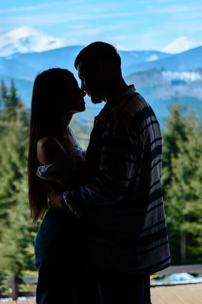 Guy Holds Girl His Arms Background Window Background Beautiful Mountain — Stock Photo, Image