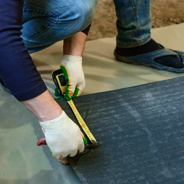 Master Prepares Bitumen Tape Installation Protection Floor Moisture Measurement Cutting — Stock Photo, Image