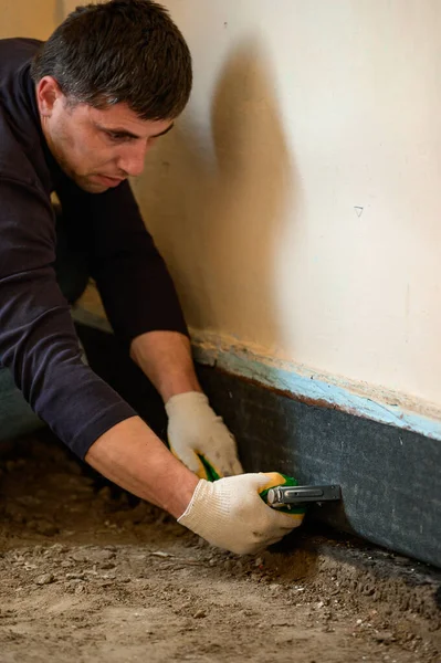 Installing Waterproofing Private House Floor Man Attaches Waterproof Tape Bottom — Stock Photo, Image