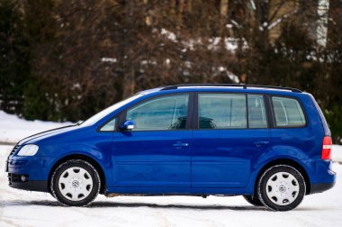 dolyna, Ukraine December 22, 2021: 2006 Volkswagen, Touran model, the color of the car is blue,side view of the car.