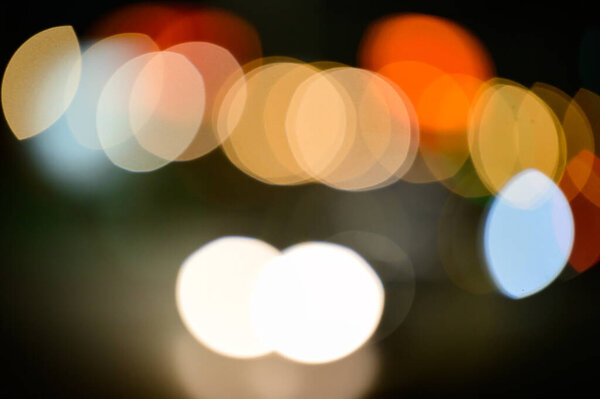 Abstract twinkling lights background with bokeh defocused multicolored lights, valentines day celebration, party, round bright bokeh.