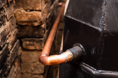 Installation of copper pipes for water supply to the fireplace, heating in the house with a fireplace.