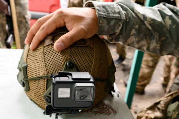 Tactical helmet and camera gopro in the Ukrainian military, NATO and its standards in Ukraine, the war in Ukraine.