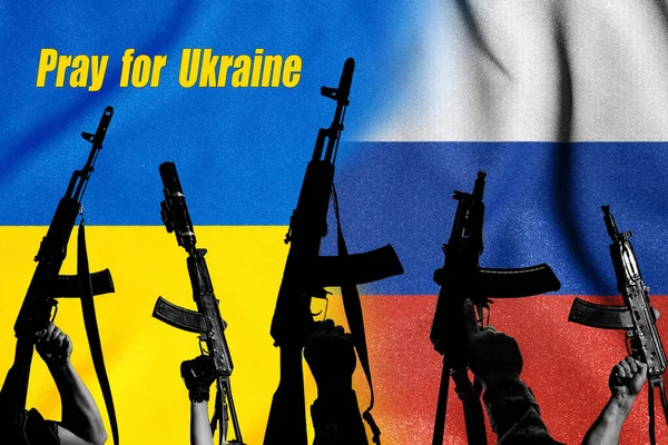 Two enemy flags and combat military assault rifles AK 74 and AK 74U on their background, Russian-Ukrainian war and Russian aggression