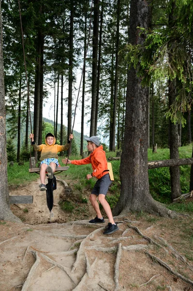 Boy Swings Swing Somewhere Forest Walk Carpathians Summer — Stock Fotó