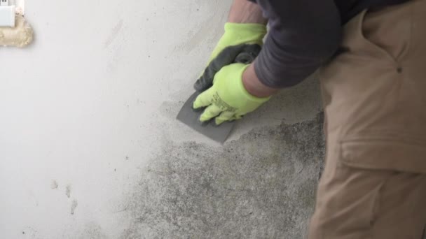 Man Gloves Mask Removes Fungus Mold Wall Spatula Slow Motion — Stock Video