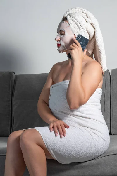 Woman Talking Phone Home Woman Mask Her Face Towel Sitting — Zdjęcie stockowe