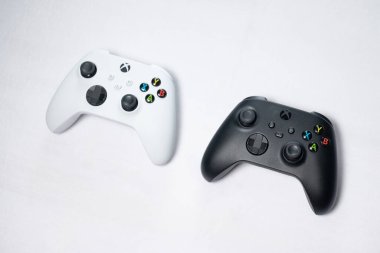 Ivano-Frankivsk, Ukraine August 14, 2022: Microsoft Xbox Wireless Controller gamepad lying on a white background, black and white gamepad.