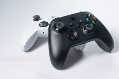 Ivano-Frankivsk, Ukraine August 14, 2022: Gamepad Microsoft Xbox Wireless Controller, two controllers black and white on a white background, joysticks for games.