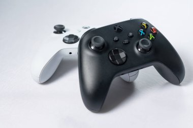 Ivano-Frankivsk, Ukraine August 14, 2022: Gamepad Microsoft Xbox Wireless Controller, two controllers black and white on a white background, joysticks for games. clipart