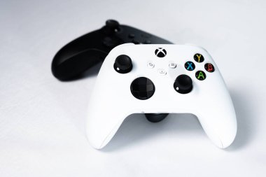 Ivano-Frankivsk, Ukraine August 14, 2022: Gamepad Microsoft Xbox Wireless Controller, two controllers black and white on a white background, joysticks for games.