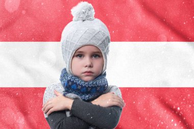 Gas crisis in AUSTRIA, Cold winter and high gas tariffs, the girl is frozen, the child without heat in winter hugs himself with his arms to keep warm.