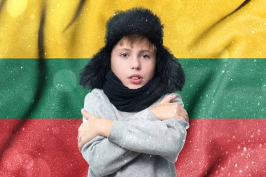Lithuania suffers the consequences of a cold and unheated winter, a European schoolboy boy is freezing in the winter heating period.