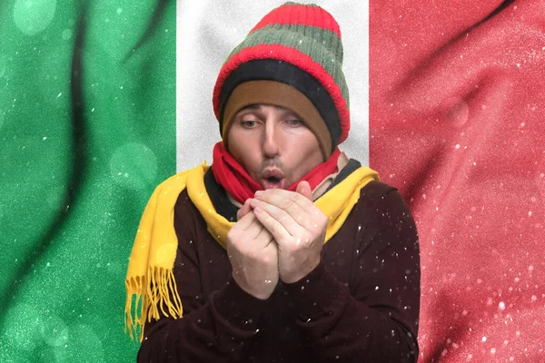 Cold winter and consequences of gas sanctions, consequences of the war in Ukraine, shortage of gas and heat in Italy, a man who is frozen warms himself with his warmth, Europeans have no warmth.