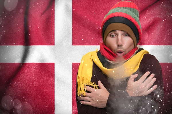 Gas crisis in Denmark, Cold winter and high gas tariffs, a European freezes from the cold and warms himself with steam from his mouth.