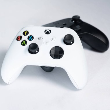 Ivano-Frankivsk, Ukraine August 14, 2022: Gamepad Microsoft Xbox Wireless Controller, two controllers black and white on a white background, joysticks for games.