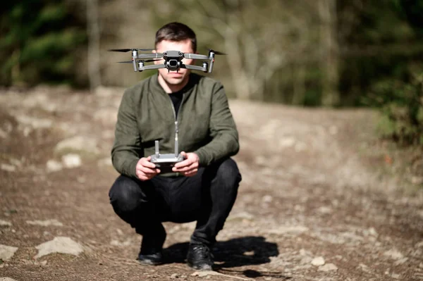 Drone pilot, quadcopter flight control with manual control panel, drone at human eye level