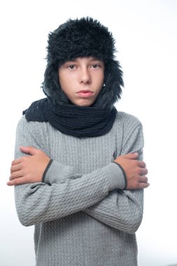 Portrait of upset guy in winter hat and scarf, cold winter and crisis time, ear hat and cold.