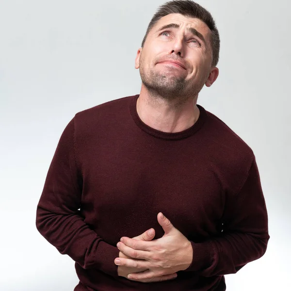 Man Touches His Stomach Two Hands White Background Copy Space — Stok fotoğraf